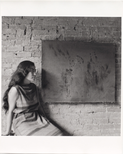 Painting to See in the Dark (Version 1), 1961. Installation view with the artist, Paintings & Drawings by Yoko Ono, AG Gallery, New York, July 17–30, 1961. Photograph: George Maciunas. The Museum of Modern Art, New York. The Gilbert and Lila Silverman Fluxus Collection Gift, 2008. © 2014 George Maciunas.